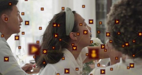 Young woman leaning and speaking at sunlit dining table with social media network overlay