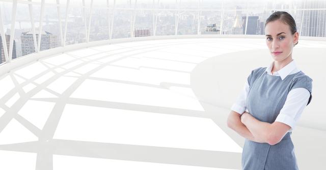 Businesswoman posing confidently with arms crossed in a modern office featuring panoramic city views. Useful for illustrating themes related to leadership, corporate success, professionalism, female executives, modern work environments, or confidence in business.