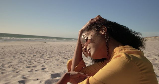 Tranquil Woman Relaxing on Sandy Beach under Clear Blue Sky - Download Free Stock Images Pikwizard.com