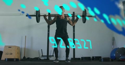 Muscular athlete squatting loaded barbell with augmented reality HUD overlay in modern gym