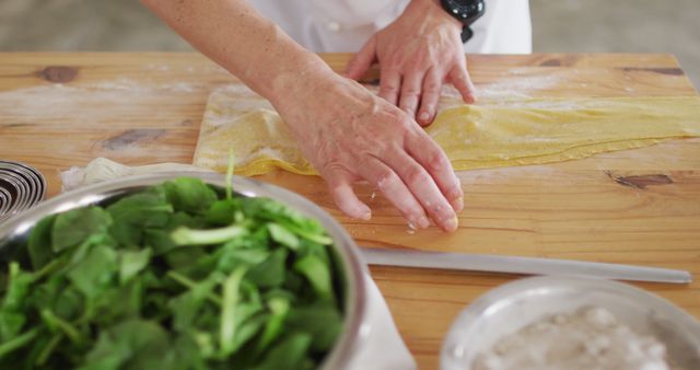 Chef preparing homemade pasta dough on wooden table - Download Free Stock Images Pikwizard.com