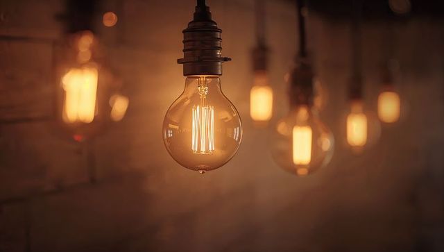 Classic Edison Filament Bulb Hanging Over Amber Bar Lighting Creating Cozy Vintage Ambience