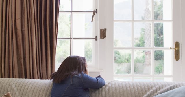 Image of sad asian girl looking outside window - Download Free Stock Photos Pikwizard.com