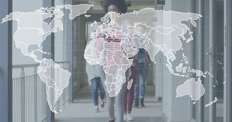 Walking young professionals in modern office corridor with global digital map overlay