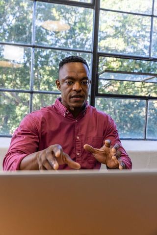 Expert Professional Gesturing During Business Presentation in Office