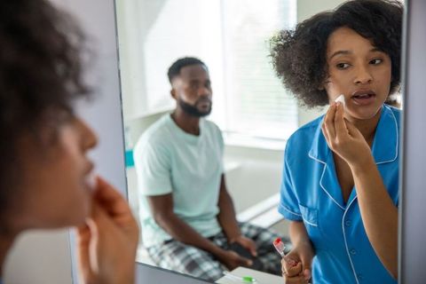 Couple's Skincare Routine in a Cozy Bathroom Setting