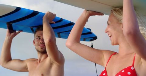 Happy Couple Carrying Surfboards on Beach Vacation - Download Free Stock Images Pikwizard.com