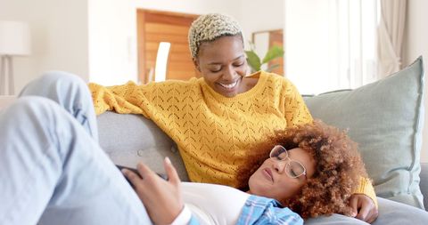 Happy Couple Relaxing Together, Using Smartphone at Home - Download Free Stock Images Pikwizard.com