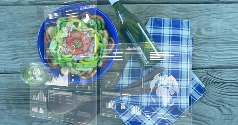 Rustic overhead salad with wine and augmented reality data overlays on wooden tabletop