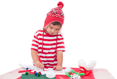 Caucasian boy creating art wearing red winter hat, isolated transparent background