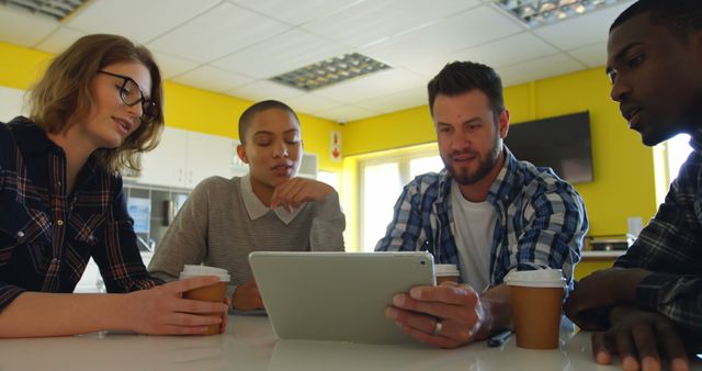 Diverse Team Collaborating on Digital Tablet in Office - Download Free Stock Images Pikwizard.com