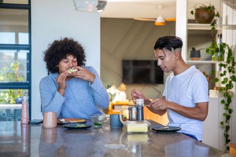 Friends Enjoying Breakfast Together in Modern Kitchen