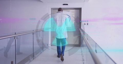 Doctor Walking Down Hospital Corridor with Futuristic Holographic Display