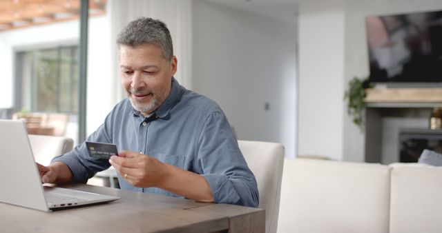 Senior Man Making Online Transaction with Laptop at Home - Download Free Stock Images Pikwizard.com