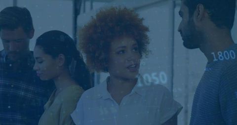 Colleagues Collaborating with Futuristic Digital Data Overlay