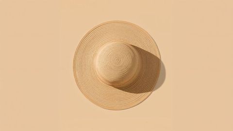 Woven Straw Sun Hat on Light Beige Background