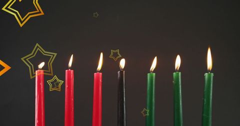 Kwanzaa Celebration with Colorful Candles Against Black Background