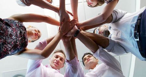 Unified Business Team with Hands Stacked in Solidarity - Download Free Stock Images Pikwizard.com