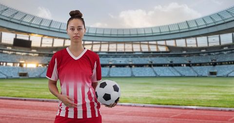 Confident Enrolled Soccer Player in Empty Modern Stadium