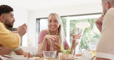 Friends Gathering Around Table Sharing Vegetarian Meal
