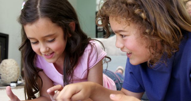 Two Happy Children Playing Games on Tablet at Home - Download Free Stock Images Pikwizard.com