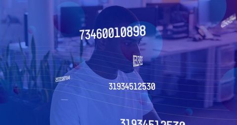 African American Man Analyzing Numbers in Digital Environment