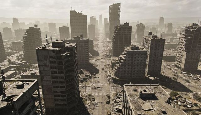 Desolate ruined city avenue with collapsing high-rise towers and debris-filled streets