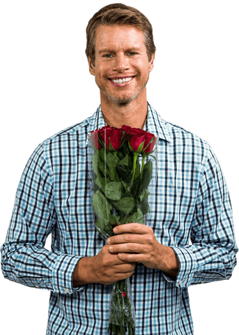 Smiling man holding romantic bouquet of red roses on transparent background