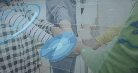 Joining hands team huddle with blue hud overlay representing digital collaboration