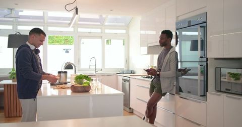 Sunlit Contemporary Kitchen Featuring Diverse Male Friends Preparing Breakfast Together