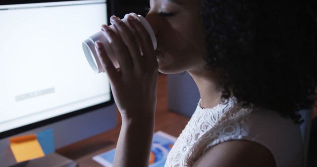 Young Woman Enjoying Coffee Break at Office Desk - Download Free Stock Images Pikwizard.com