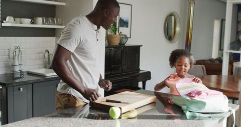 Father and Daughter Enjoying Quality Breakfast Preparation Together