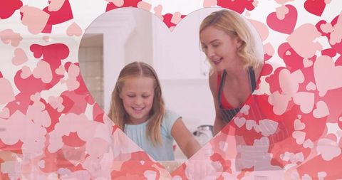 Mother and Daughter Baking Together with Pink Heart Overlay