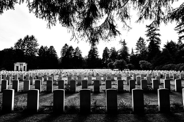 Silhouetted View of Military Cemetery at Sunset - Download Free Stock Photos Pikwizard.com