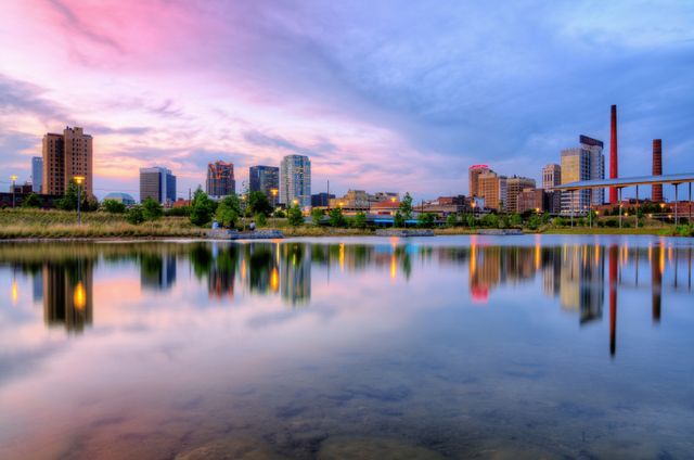 Stunning Waterfront Cityscape During Sunset with Calm Reflections - Download Free Stock Photos Pikwizard.com