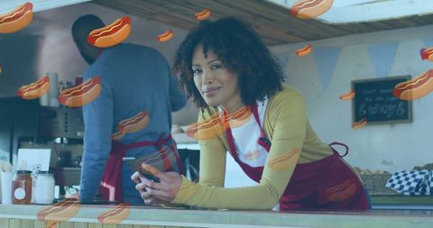 food truck vendor using smartphone with floating hot dogs - Download Free Stock Images Pikwizard.com