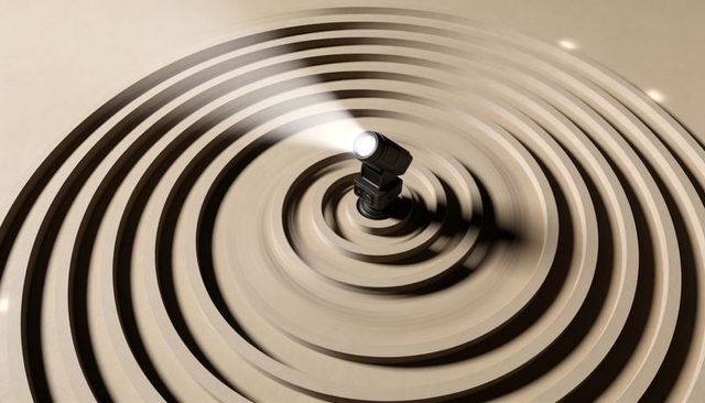 Studio flash casting beam over minimalist tan concentric rings creating dramatic light and shadow