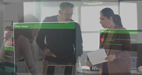 Team reviewing laptop and documents in modern office meeting with critical error overlay