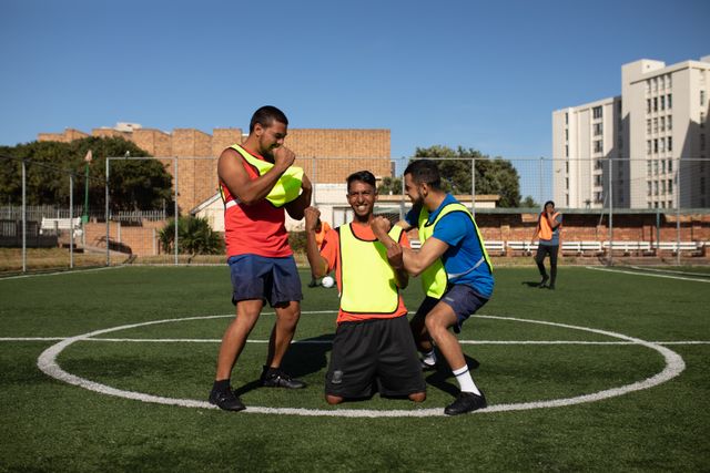 Multi Ethnic Male Football Players Celebrating on Sports Field - Download Free Stock Images Pikwizard.com