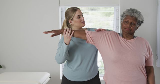 Senior Woman Undergoing Physical Therapy Session with Therapist - Download Free Stock Images Pikwizard.com