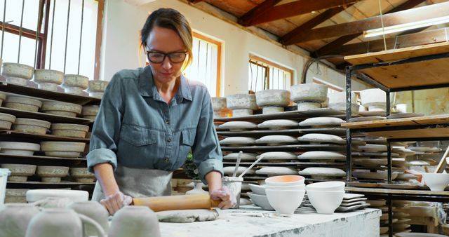 Female Artisan Rolling Clay for Handmade Pottery in Studio - Download Free Stock Images Pikwizard.com