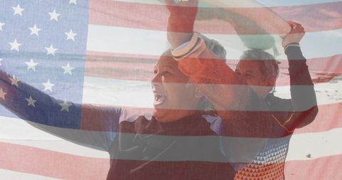 Senior Couple with Surfboard Celebrating American Patriotism on Beach