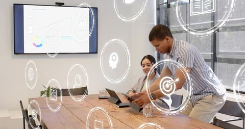 Business team collaborating with augmented reality analytics overlay in modern boardroom