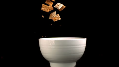 Square Cereal Falling Elegantly into a Bowl