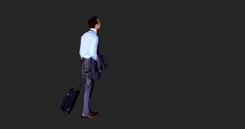 Businessman Awaiting Journey with Luggage and Suit Jacket