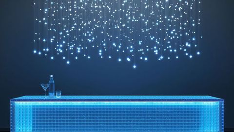 Futuristic neon bar counter casting blue led glow with hanging light curtain and glassware
