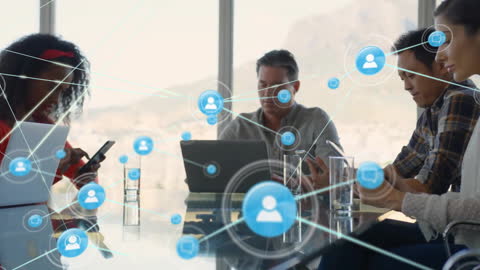 Diverse Professionals Networking with Digital Technology in Modern Office