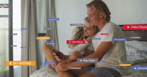 Couple Engaging with Smartphone and Social Media Icons at Home