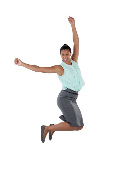 Businesswoman in professional attire jumping in the air, expressing excitement and joy. Perfect for concepts related to success, achievement, and positive energy in the workplace. Can be used in business presentations, motivational materials, and advertisements promoting professional success.