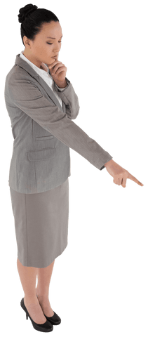 Businesswoman dressed in professional outfit points upward, suggesting focus and clarity. Suitable for business presentations, leadership concepts, decision-making discussions, or advertisements requiring corporate context.